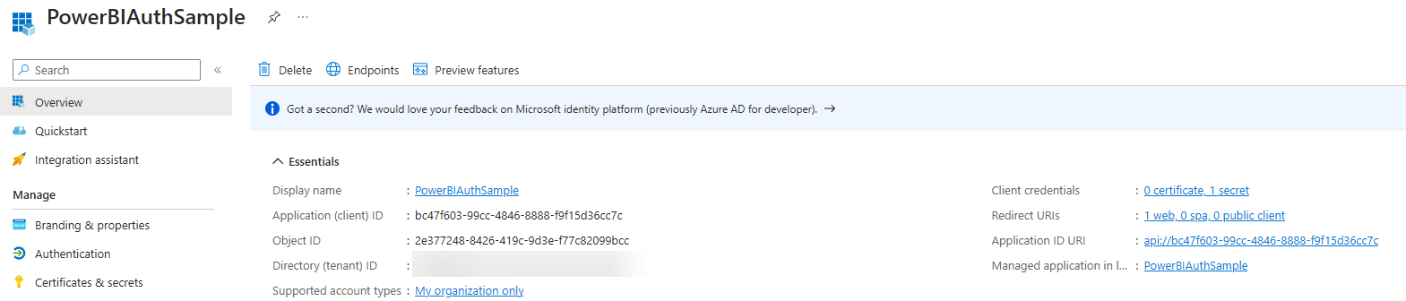 Overview page of the PowerBIAuthSample app registration in Entra ID